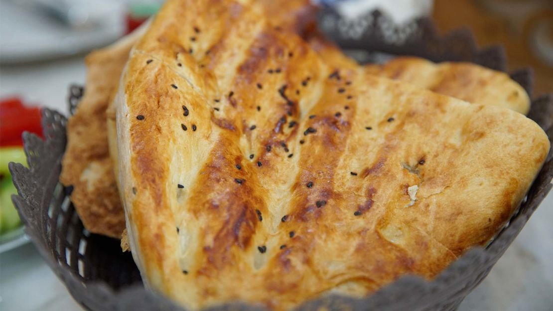 Tandir bread is brushed with egg or yoghurt then baked in a clay oven. 