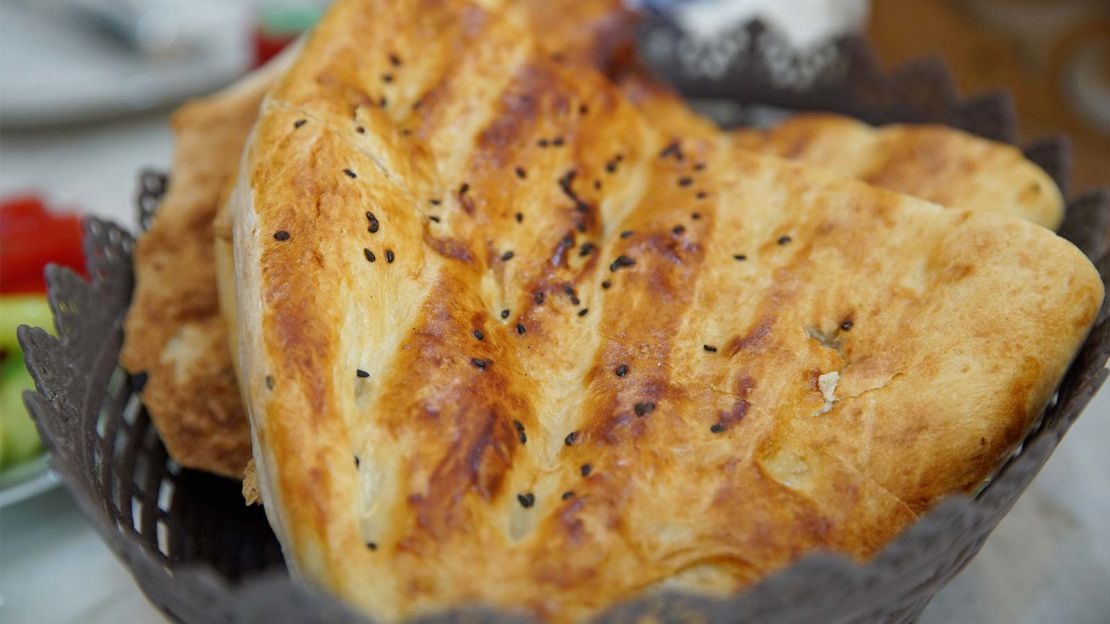 Tandir bread is brushed with egg or yoghurt then baked in a clay oven.