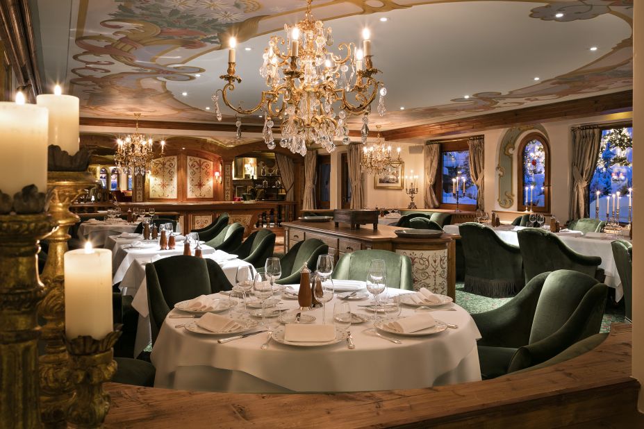 <strong>The lunch spot - La Table Les Airelles, Courchevel, France:</strong> Sunken green velvet chairs, glowing candles and ornate decor welcome guests looking for a memorable and upscale meal.