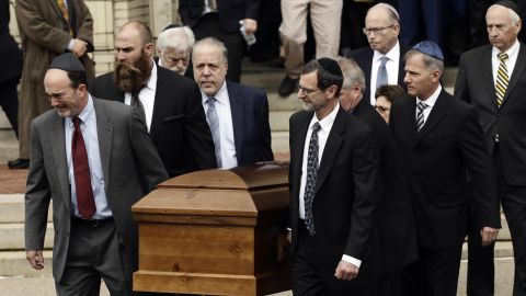 A casket is carried out of Rodef Shalom Congregation after funeral services for brothers Cecil and David Rosenthal on Tuesday in Pittsburgh.
