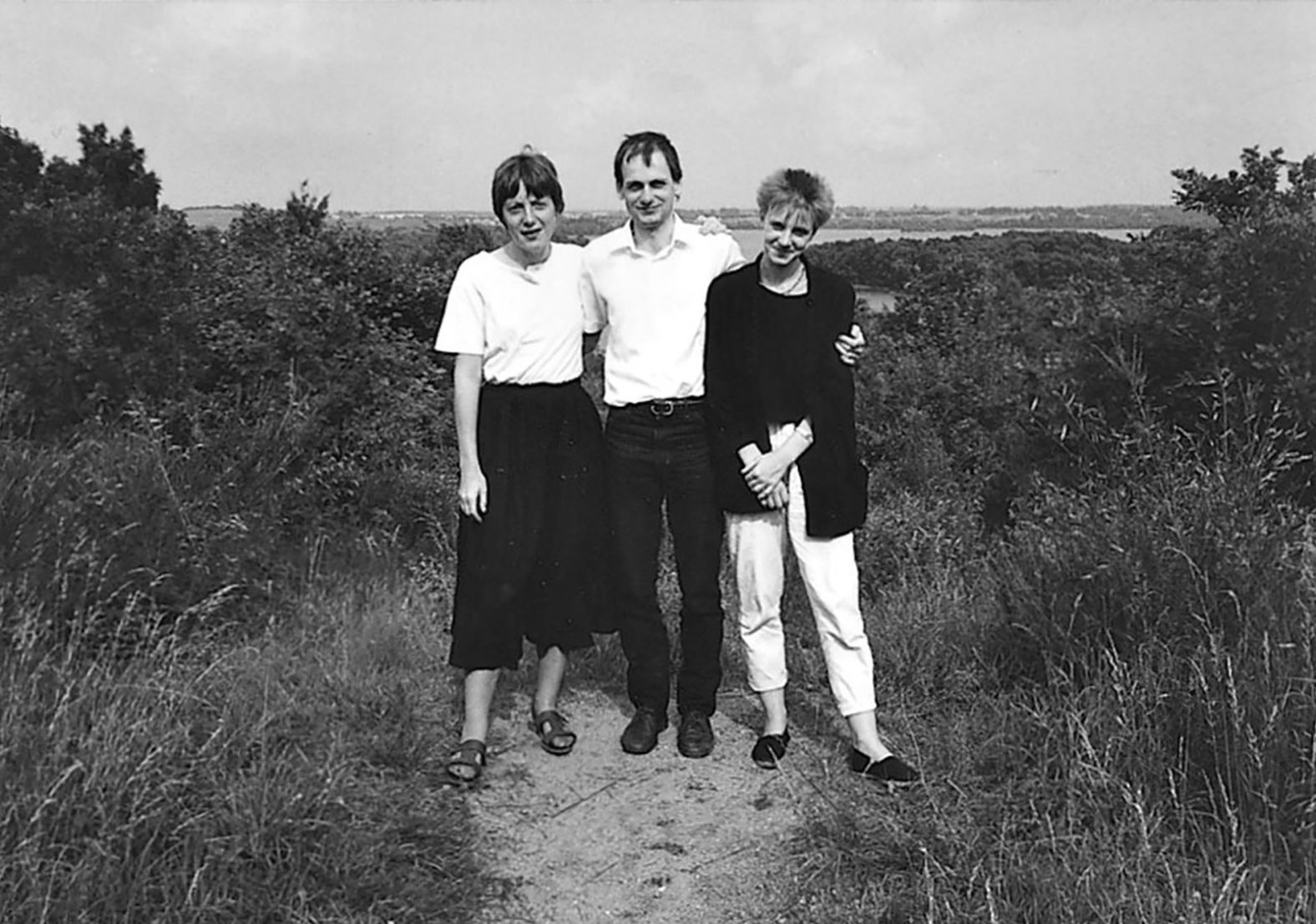 Merkel poses with her siblings, Marcus and Irene Kasner.