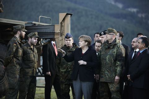 Merkel visits troops stationed in Turkey in February 2013. Later that year she was re-elected for a third term.