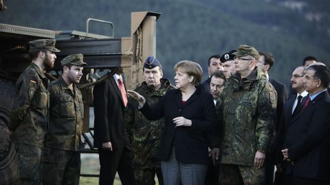 Merkel visits troops stationed in Turkey in February 2013. Later that year she was re-elected for a third term.