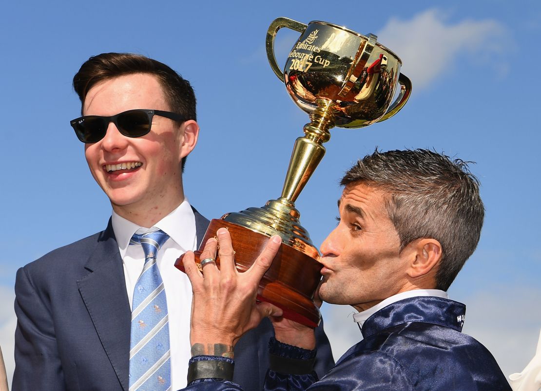Rekindling's trainer Joseph O'Brien (left) and jockey Corey Brown with the Melbourne Cup.