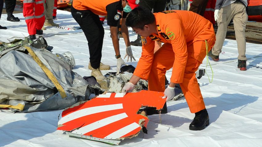 Rescue team members arrange the wreckage, showing part of the logo of Lion Air flight JT610, that crashed into the sea, at Tanjung Priok port in Jakarta, Indonesia, October 29, 2018. REUTERS/Stringer