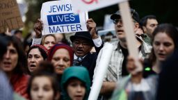 Protesters demonstrate near Pittsburgh's Tree of Life Synagogue where President Donald Trump and first lady Melania Trump were visiting a memorial in Pittsburgh, Tuesday, Oct. 30, 2018. The Trumps came to Pittsburgh to honor the victims of a mass shooting at the synagogue last week.