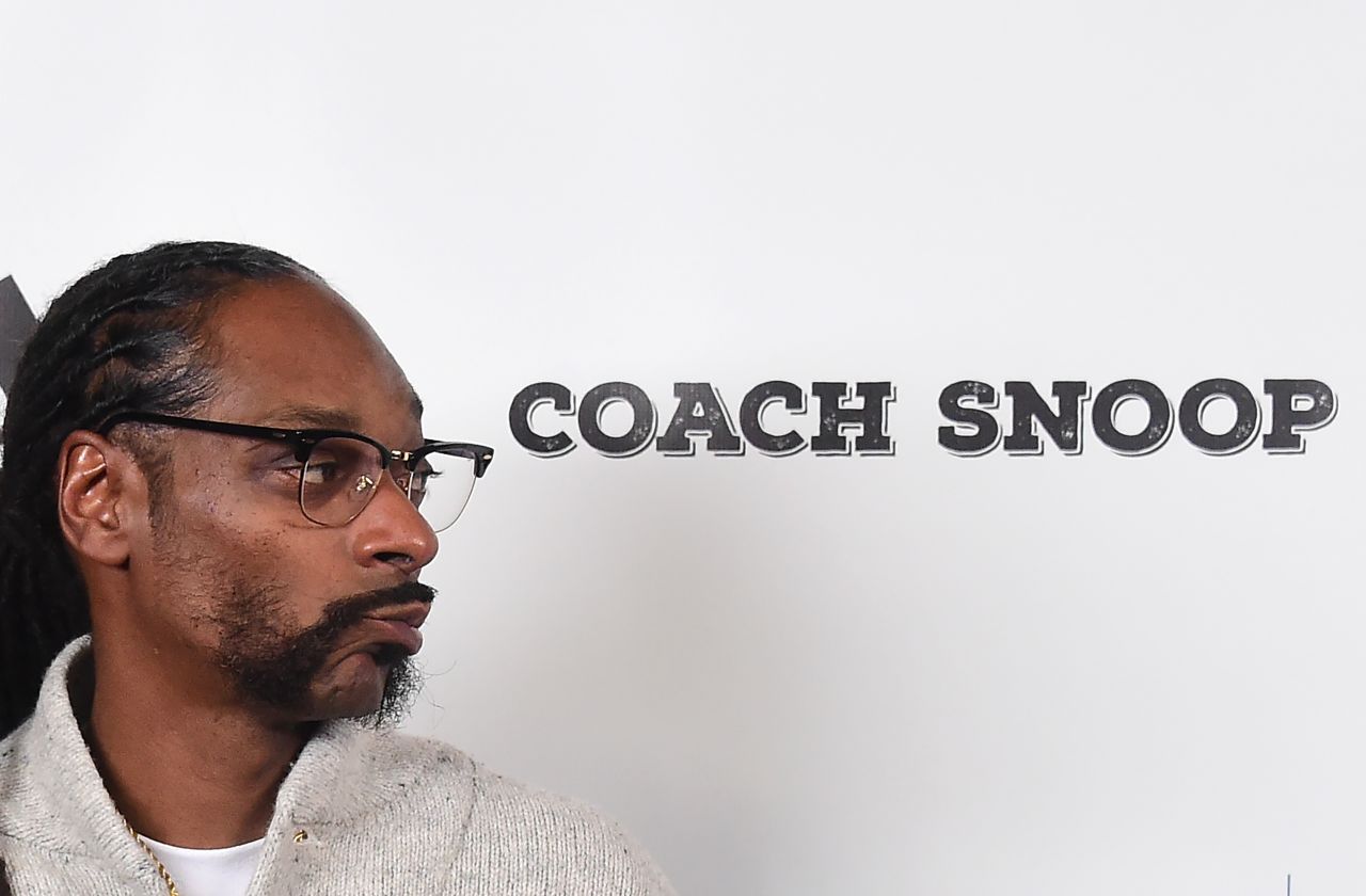 Snoop Dogg arrives at the premier of his docuseries "Coach Snoop" in Hollywood, California on May 16, 2016. The series shadows the rapper as he coaches his team in the Snoop Youth Football League which launched in Los Angeles in 2005.