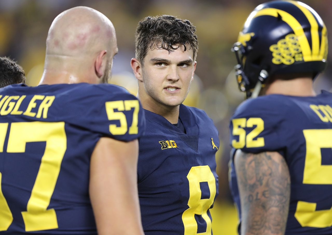 Second-string quarterback John O'Korn (#8) of the Michigan Wolverines featured prominently in the Amazon Prime series "All or Nothing: The Michigan Wolverines." The senior had an up and down 2017, which culminated at an emotional press conference after throwing a game-ending interception against rivals Ohio State. 