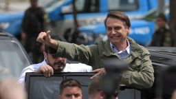 Jair Bolsonaro, far-right lawmaker and presidential candidate for the Social Liberal Party (PSL), waves to supporters during the second round of the presidential elections, in Rio de Janeiro, Brazil on October 28, 2018. - Brazilians will choose their president today during the second round of the national elections between the far-right firebrand Jair Bolsonaro and leftist Fernando Haddad (Photo by Carl DE SOUZA / AFP)        (Photo credit should read CARL DE SOUZA/AFP/Getty Images)