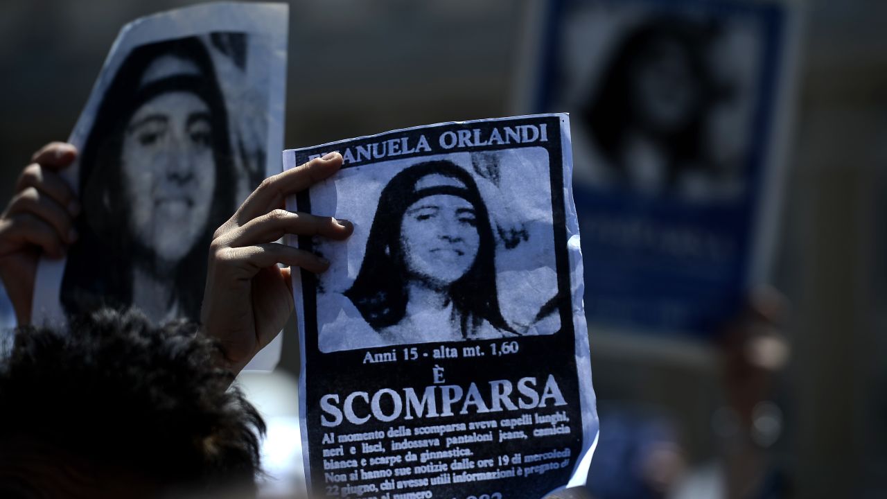 A demonstrator holds a poster of Emanuela Orlandi reading "Missing" during then-Pope Benedict XVI's Regina Coeli noon prayer in St. Peter's Square, at the Vatican on May 27, 2012.