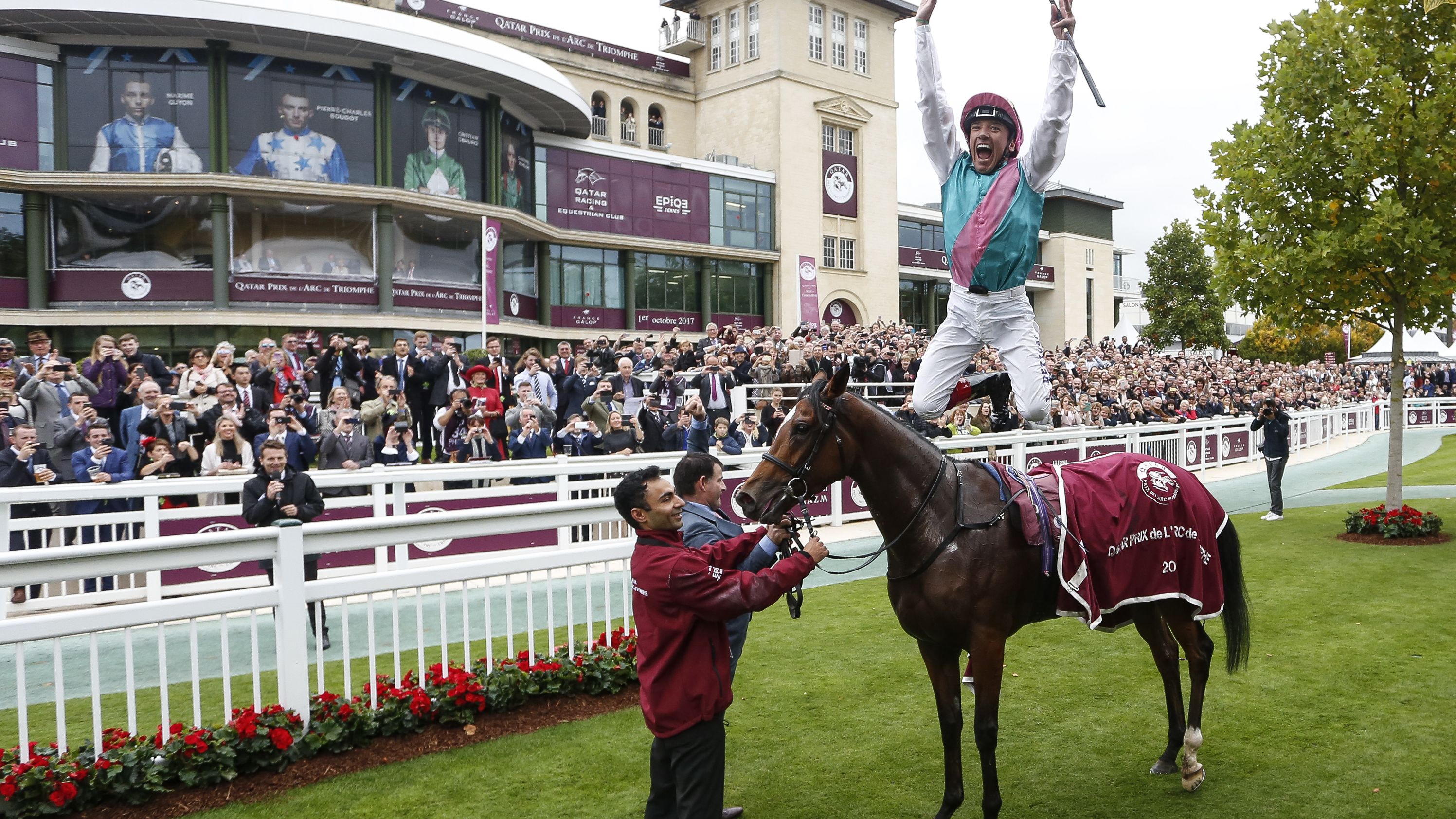 Frankie Dettori performs his trademark flying dismount after Enable won her first Arc in 2017.