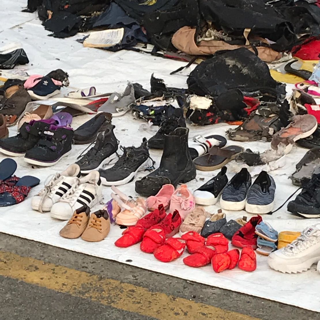 Shoes are lined up on the ground of Tanjung Priok port.