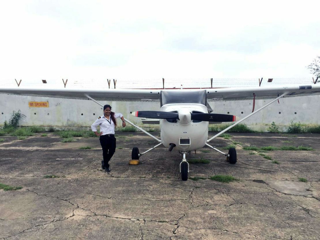 Captain Tarana Saxena poses with beside a Cessna at Banasthali Vidyapith University.