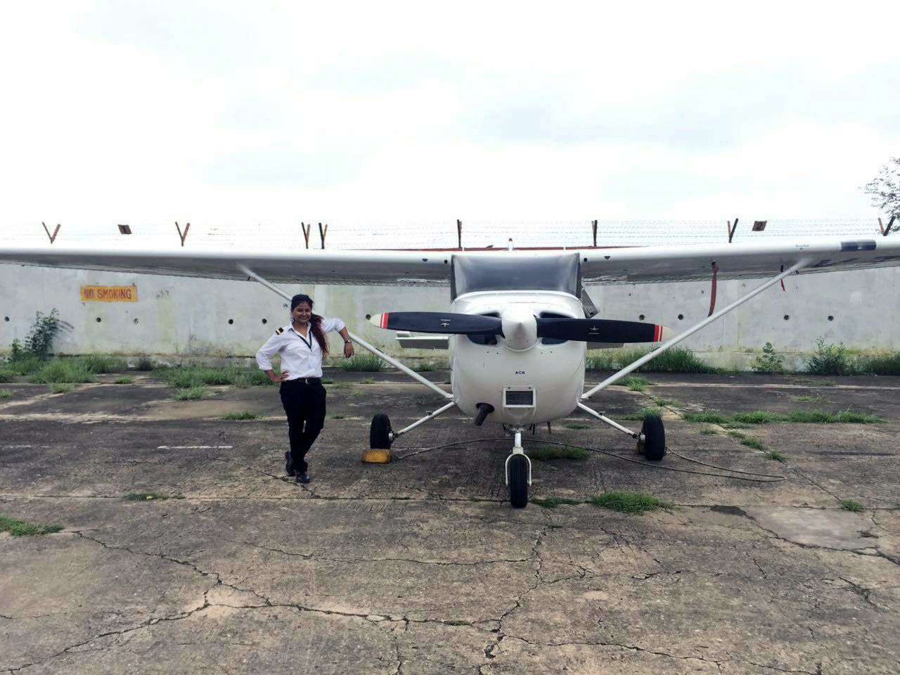 <strong>The sky is calling: </strong>Tarana Saxena, a recent graduate, poses beside a Cessna at Banasthali Vidyapith University. "I couldn't believe how amazing it felt to be in the air," she says of her first flight. "I wanted five more minutes, 10 more minutes...I wanted it to last forever." 