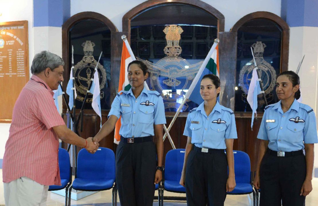 In 2016, Indian Minister of Defence Manohar Parrikar congratulates the Indian Air Force's first three female fighter pilots: Bhawana Kanth (L), Avani Chaturvedi (C) and Mohana Singh.