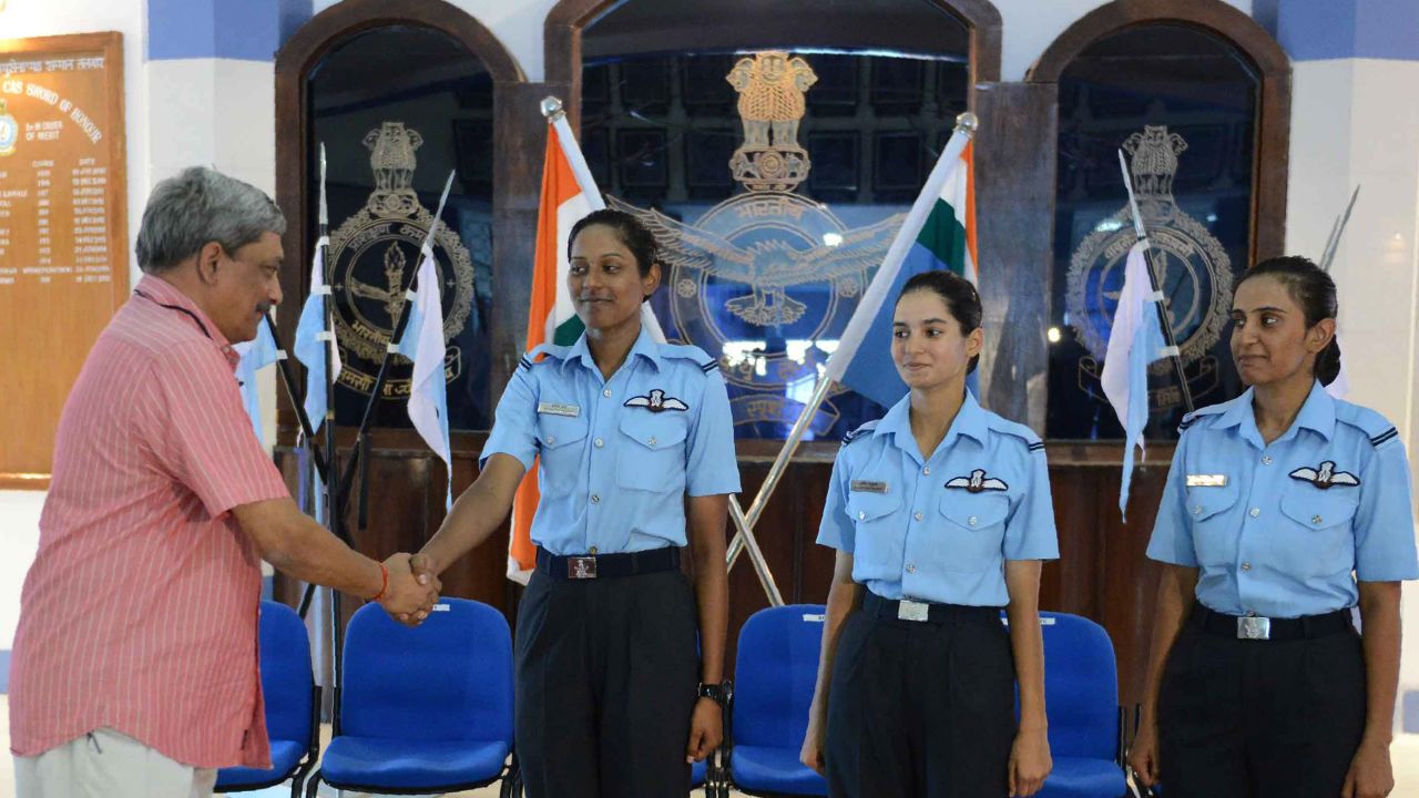 In 2016, Indian Minister of Defence Manohar Parrikar congratulates the Indian Air Force's first three female fighter pilots: Bhawana Kanth (L), Avani Chaturvedi (C) and Mohana Singh.