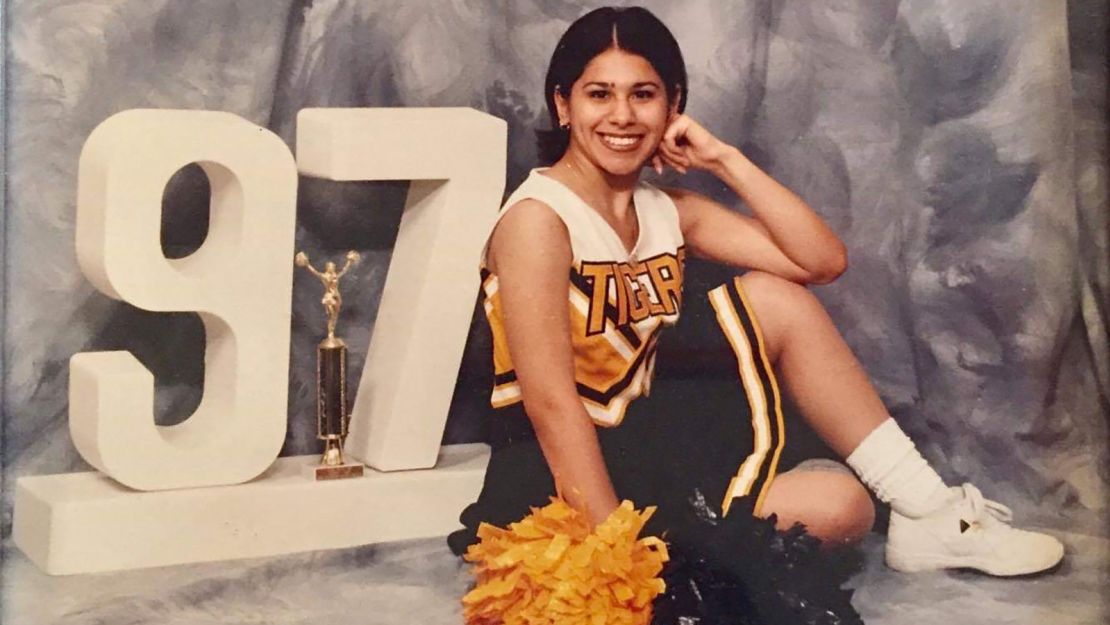 Alma Faz in her cheerleading uniform in 1997. 