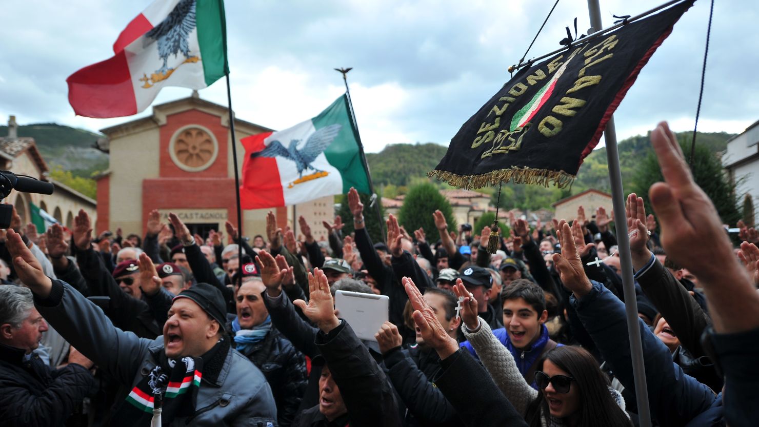Far-right militants make the fascist salute during a rally marking the 90th anniversary of the "March on Rome" in 2012.