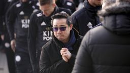 LEICESTER, ENGLAND - OCTOBER 29: Aiyawatt Srivaddhanaprabha the son of Leicester City's Thai chairman Vichai Srivaddhanaprabha who died in a helicopter crash at the club's stadium, pays his respects among the sea of tributes to the victims of the crash at Leicester City Football Club's King Power Stadium on October 28, 2018 in Leicester, England. The owner of Leicester City Football Club, Vichai Srivaddhanaprabha, was among the five people who died in the helicopter crash on Saturday evening after the club's game against  West Ham. (Photo by Christopher Furlong/Getty Images)