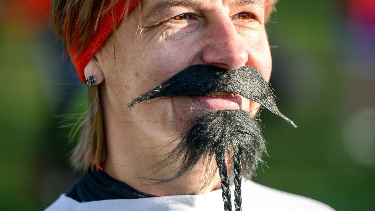 Nelly Ivanova, 46, shows her support for prostate cancer by wearing a fake mustache.