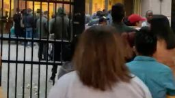 In this screengrab from a handout video provided by the American Immigration Lawyers Association, people are seen lining up outside the Atlanta Immigration Court on October 31.