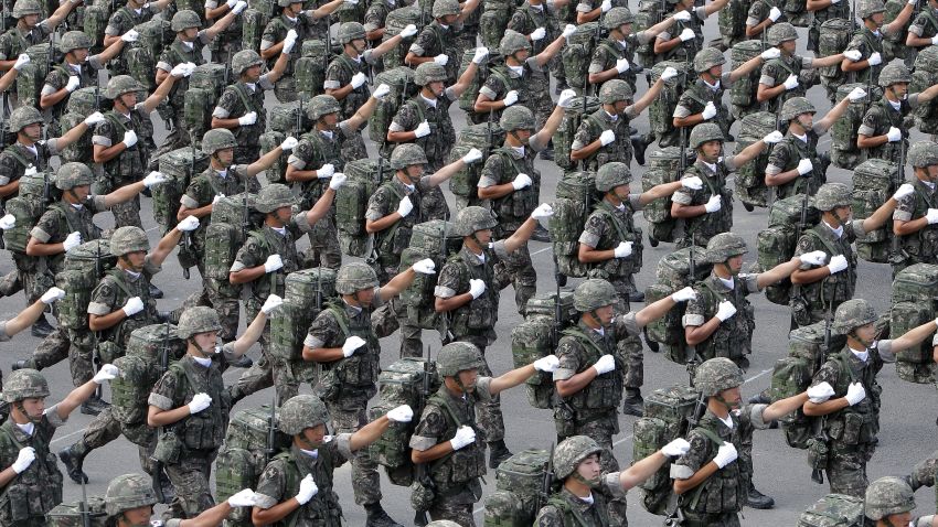 SEONGNAM, SOUTH KOREA - OCTOBER 01:  South Korean army soldiers march during the 65th South Korea Armed Forces Day ceremony at Seongnam Military Airbase on October 1, 2013 in Seongnam, South Korea. More than 11 thousand troops participated in this year's ceremony while about 300 of the latest air and ground military equipment were showcased. (Photo by Chung Sung-Jun/Getty Images)