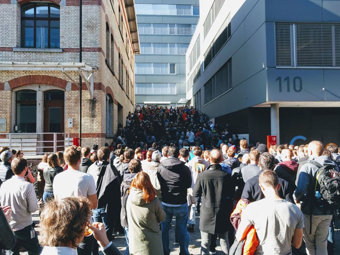 Crowds gather outside the Google office in Zurich.  