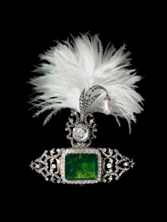 "Mughal emperors originally wore turban ornaments known as 'sarpechs' to show off dazzling large gemstones, while egret feathers also signaled their rank as an emblem of authority," said Chapman. In the late 19th and early 20th century, Indian Maharajas started to patronize European jewelry houses, including Cartier and Boucheron, to celebrate their vast collection of stones. Here the border of brilliant-cut diamonds and a substantial emerald echo European jewelry designs as the gems are not encased in closed settings that were typical of Indian jewelry.