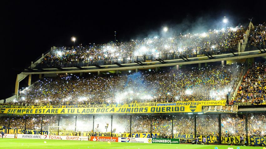 Supporters of Boca Juniors cheer for their team before their Copa Sudamericana semifinal football match against River Plate at La Bombonera stadium in Buenos Aires, Argentina, on November 20, 2014. AFP PHOTO / Maxi Failla        (Photo credit should read Maxi Failla/AFP/Getty Images)