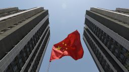 A Chinese flag flies outside a residential compound in Beijing on April 30, 2017.
China has launched perhaps its most concerted push yet to clean up a toxic brew of unregulated and risky lending increasingly viewed as a threat to global financial stability, but do authorities really mean business this time? Analysts don't think so. China's addiction to debt-fueled growth powers the steady economic expansion that the ruling Communist Party craves, and it won't go cold turkey, they said. / AFP PHOTO / GREG BAKER / TO GO WITH AFP STORY: China-economy-credit-loans-debt-government, FOCUS by Dan Martin        (Photo credit should read GREG BAKER/AFP/Getty Images)
