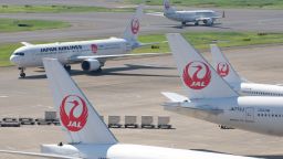 Passenger planes of Japan Airlines are seen at Tokyo's Haneda airport on July 31, 2018. - Major Japanese carriers All Nippon Airways (ANA) and Japan Airlines (JAL) on July 31 reported sluggish April-June profits as fuel costs weighed despite higher revenues. (Photo by Kazuhiro NOGI / AFP)        (Photo credit should read KAZUHIRO NOGI/AFP/Getty Images)