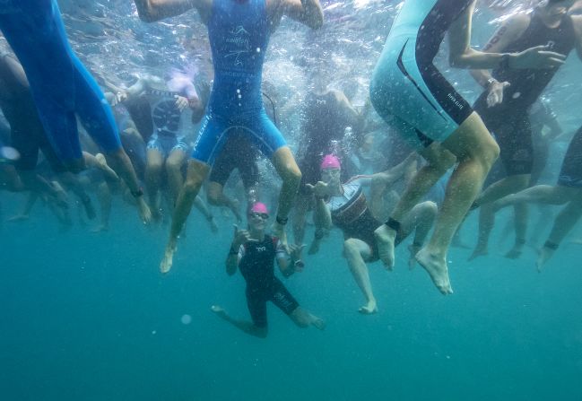 Athletes tread water while they wait for the start of the race. There are multiple categories for different age-groups and abilities.