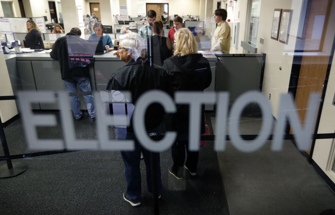 Residents line up for early voting in Des Moines, Iowa.