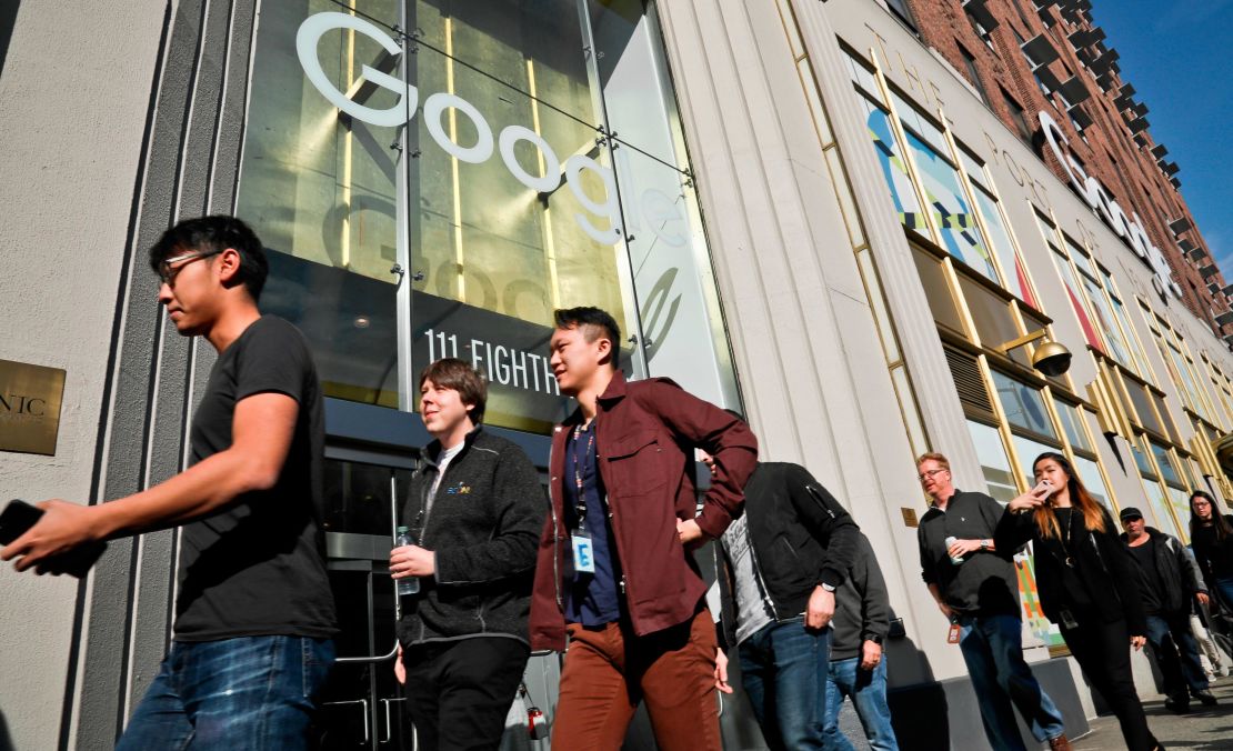 Google employees stream out of the office in New York City.