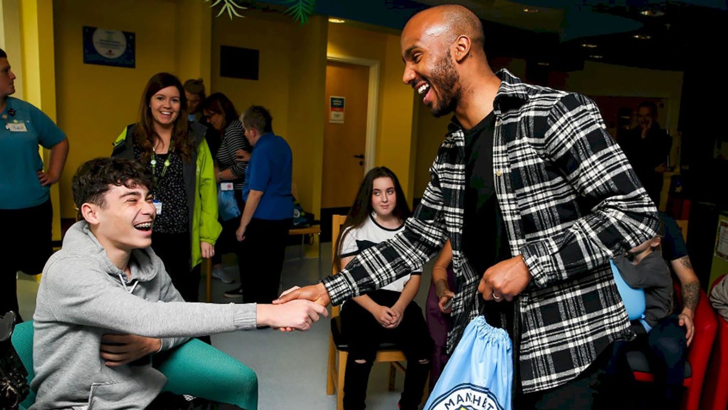 The new pain distraction unit was funded by Manchester City players including Fabian Delph (right).