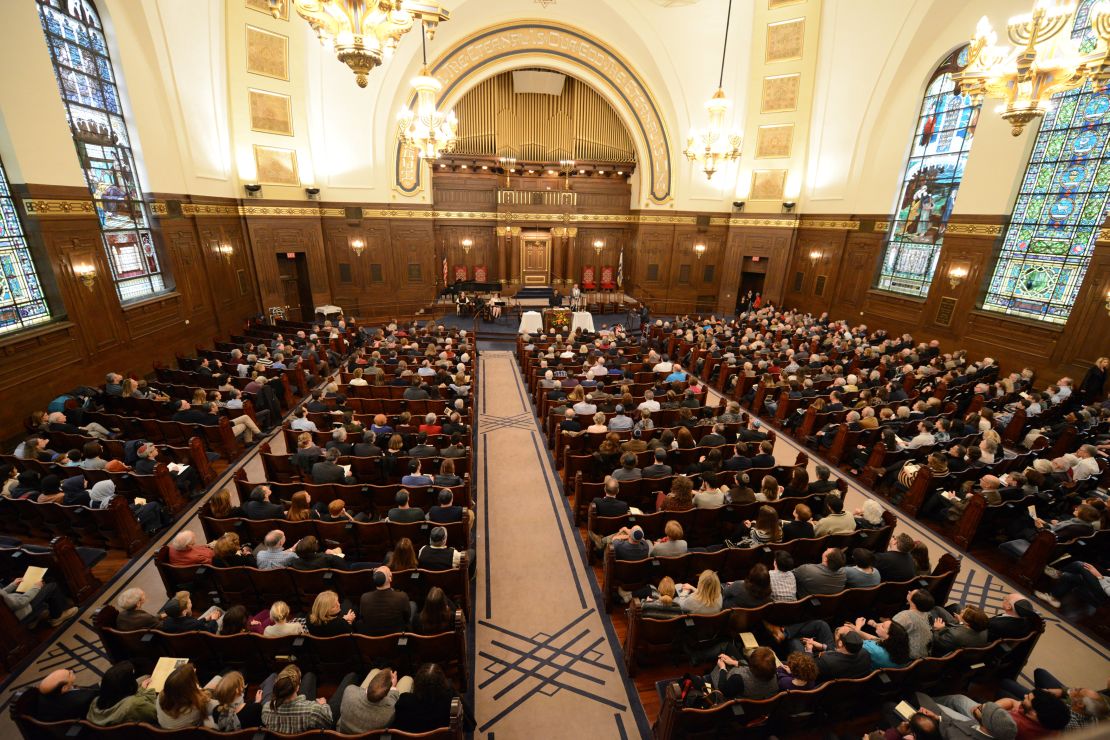 Congregants of various faiths gather Friday with the Rodef Shalom congregation in Pittsburgh. 
