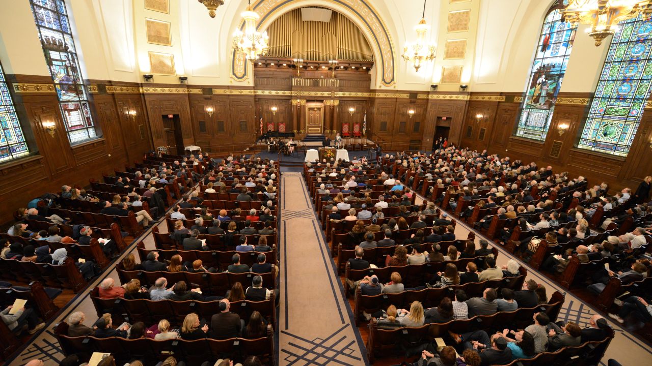 Congregants of various faiths gather Friday with the Rodef Shalom congregation in Pittsburgh.