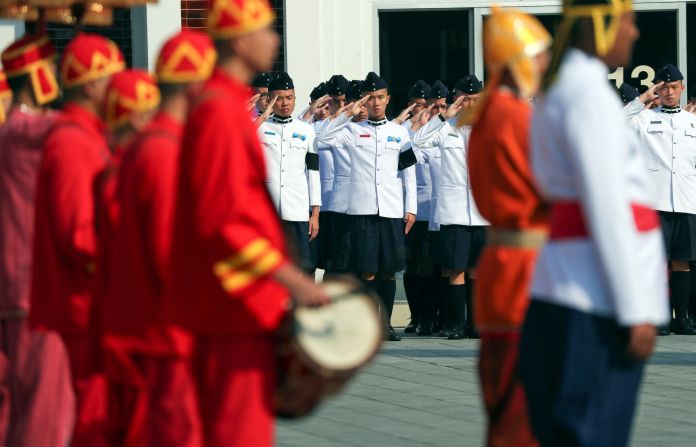 Royal soldiers attend a procession at the temple hosting the funeral of Srivaddhanaprabha.