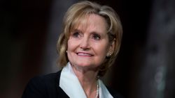 UNITED STATES - APRIL 9: Sen. Cindy Hyde-Smith, R-Miss., attends her swearing-in ceremony the Capitol's Old Senate Chamber after being sworn in on the Senate floor on April 9, 2018. (Photo By Tom Williams/CQ Roll Call)