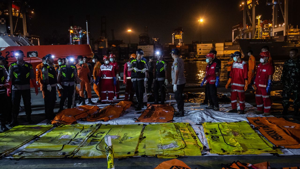 Body bags are laid out at Jakarta's Tanjung Priok port on November 3.