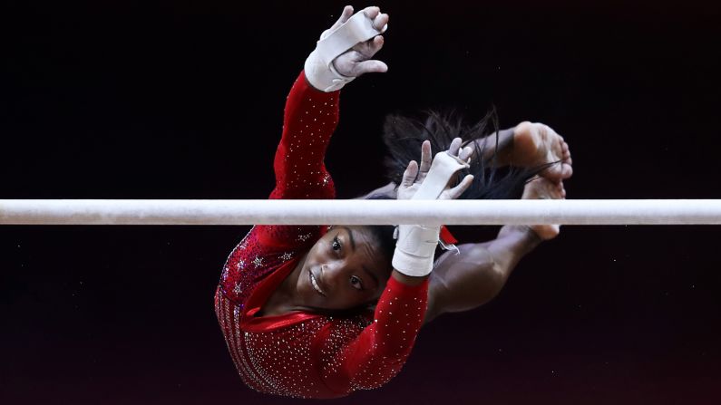 United States gymnast Simone Biles competes in the uneven bars competition during the Women's team final at the 2018 FIG Artistic Gymnastics World Championships on October 30, 2018 in Doha, Qatar. Biles led the US to victory in the team event and also captured her <a href="index.php?page=&url=https%3A%2F%2Fwww.cnn.com%2F2018%2F10%2F30%2Fsport%2Fusa-womens-gymnastics-wins-world-team-championship%2Findex.html" target="_blank">record breaking fourth all-around title at the championships.</a>