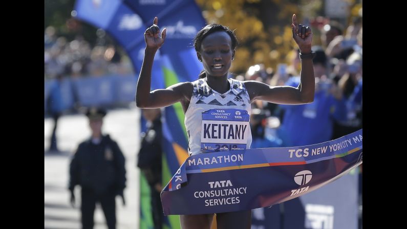 Mary Keitany of Kenya crosses the finish line to win the New York City Marathon in New York, Sunday, November 4, 2018. Keitany won her fourth <a href="index.php?page=&url=https%3A%2F%2Fwww.cnn.com%2F2018%2F11%2F04%2Fus%2Fnew-york-city-marathon-winner%2Findex.html" target="_blank">NYC Marathon title in dominating fashion</a>, finishing more than three minutes ahead of the next closest runner.