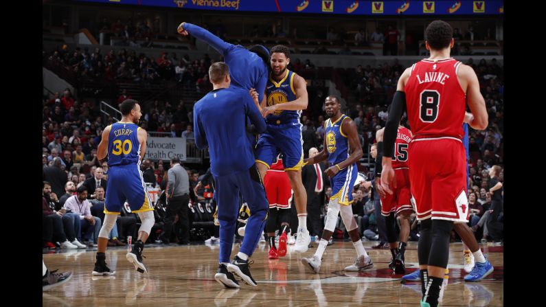 Golden State Warriors guard Klay Thompson celebrates during a game against the Chicago Bulls after breaking the NBA record for most 3-pointers in a game -- 14. His teammate, Stephen Curry, held the record before him.