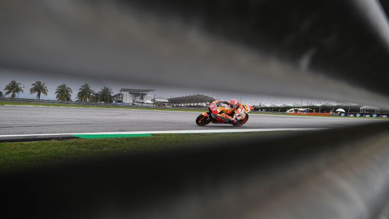Repsol Honda Team's Spanish rider Marc Marquez negotiates a corner during the second practice session of the Malaysia MotoGP at the Sepang International Circuit in Sepang on November 2, 2018.