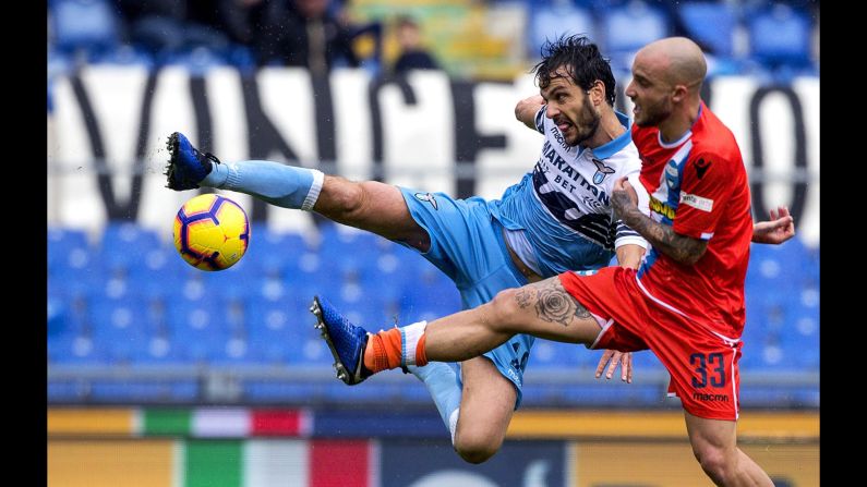 Lazio's Marco Parolo and SPAL's Filippo Costa vie for the ball during the Serie A soccer match between SS Lazio and SPAL at the Olympic stadium in Rome on November 4, 2018.