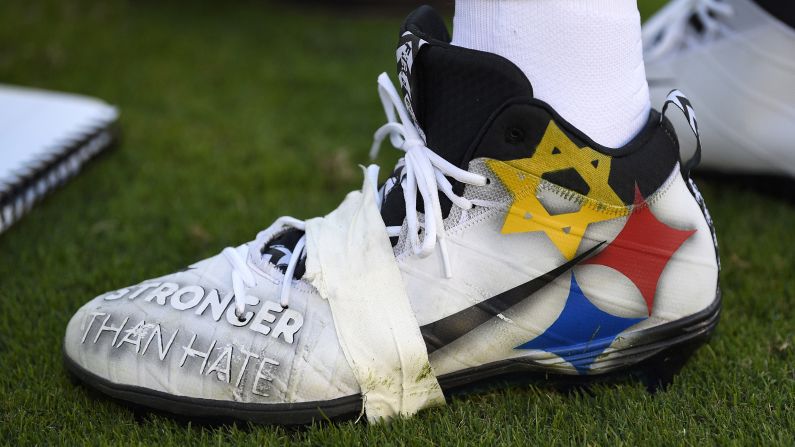 Pittsburgh Steelers quarterback Ben Roethlisberger wears cleats emblazoned with a message recognizing last month's mass shooting at the Tree of Life Synagogue in Pittsburgh. The cleats feature the words "Stronger Than Hate" and a modified version of the Steelers logo, substituting the usual gold star with the Jewish Star of David.