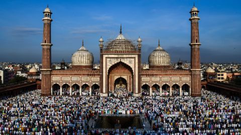 Indian Muslims offer Eid al-Adha prayers at the Jama Masjid mosque in New Delhi on August 22, 2018. - Muslims are celebrating Eid al-Adha (the feast of sacrifice), the second of two Islamic holidays celebrated worldwide marking the end of the annual pilgrimage or Hajj to the Saudi holy city of Mecca. (Photo by CHANDAN KHANNA / AFP)        (Photo credit should read CHANDAN KHANNA/AFP/Getty Images)
