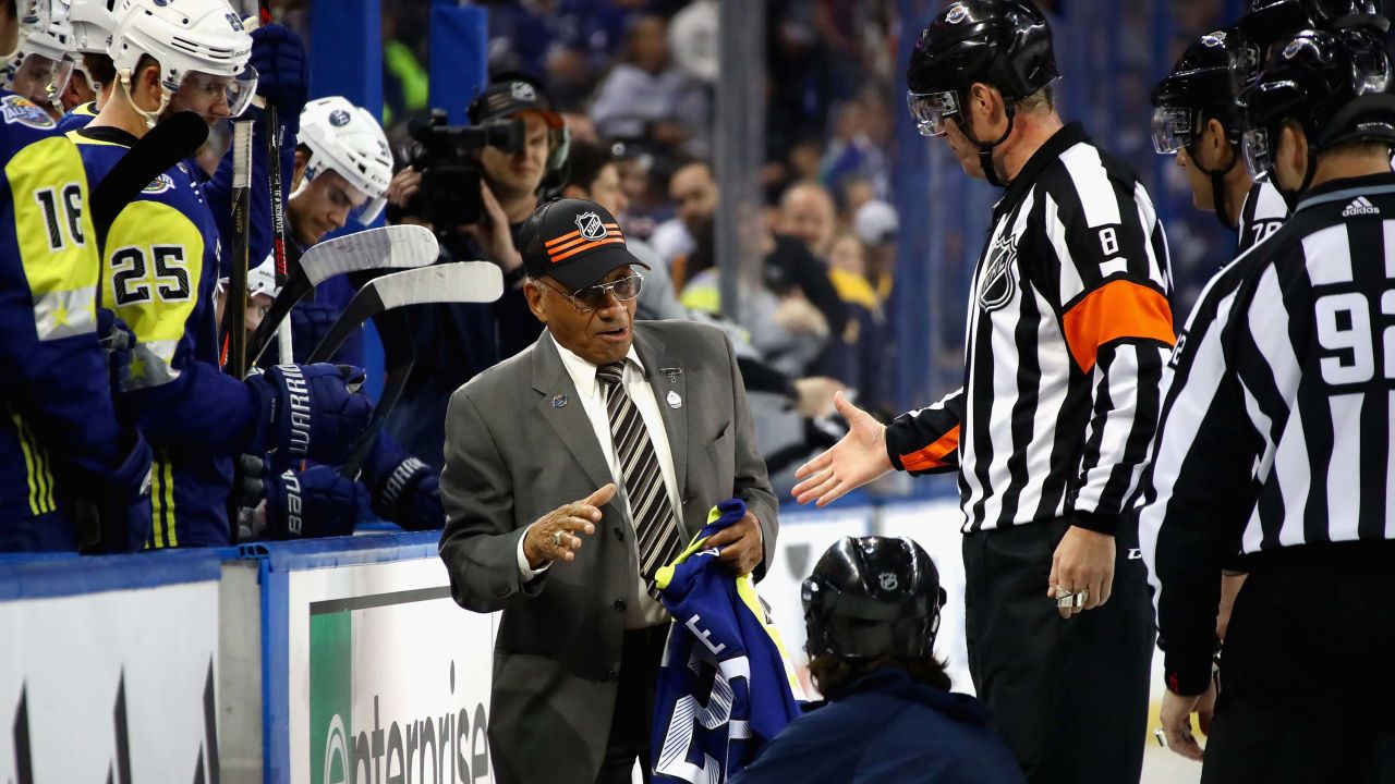Willie O'Ree is honored on the ice during half-time of the 2018 NHL All-Star Game between the Atlantic Division and the Metropolitan Divison at Amalie Arena in January 2018.