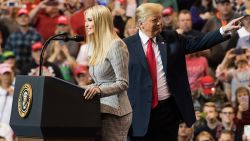 US President Donald Trump gestures as his daughter Ivanka Trump speaks at a Make America Great Again rally in Cleveland, Ohio on November 5, 2018. (Photo by Jim WATSON / AFP)        (Photo credit should read JIM WATSON/AFP/Getty Images)