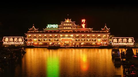 At night, Hong Kong's Jumbo Kingdom lights up the Aberdeen harbor. 